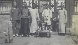 Brian Boyd Cooper with his birthday presents and domestic staff, Peking