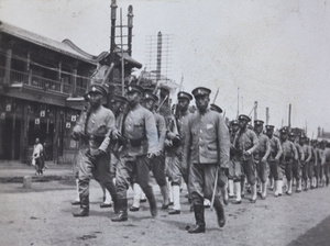 Republican soldiers, marching in a street
