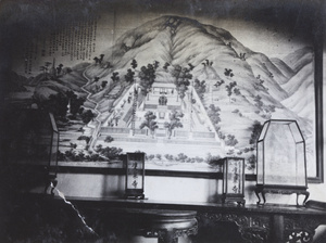 A painting, with other decorative items on a side table, Peking