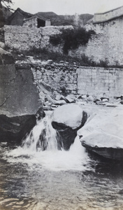 William Boyd Cooper in a small waterfall, near Peking