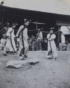 Manchu women outside a mat shed, Peking