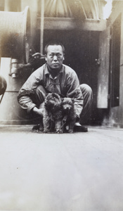 A Chinese Labour Corps man, with two Chow Chow dogs (鬆獅犬), on a ship