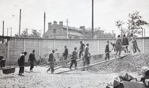 Convicts working in a prison stone breaking yard, Shanghai