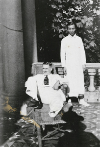 E.E. Wilkinson and a Chinese man on a veranda