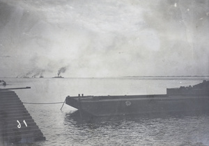 Barge in foreground, with Qing navy cruisers near Kilometre Ten